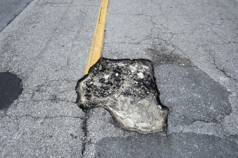 How Weather Conditions Affect Asphalt Cracks And Potholes